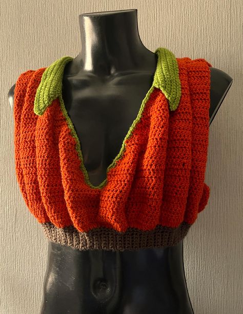 .pdf PATTERN ONLY  English Only   US Crochet Terms Size: 76-148cm/30"-58" Crochet PDF Pattern, Pumpkin Crop Top Skill Level: intermediate This crochet pattern is for a Seasonal Squash inspired crop top. Whether you are heading out for Halloween or spicing up a Thanksgiving Pie, you will want everyone to see you in this Pumpkin Crop Top. The design features multiple 3-D ruffles and a dramatic V-Neck. The collar can be any width you want, so keep it neat or make it big like pumpkin leaves. There i Cobweb Crochet Top, Disenchantment Halloween Costumes, Crochet Pumpkin Cardigan, Crochet Pumpkin Hat Pattern, Fall Crochet Projects Clothes, Crochet Cat Halloween Costume, Ribcage Crochet, Crochet Christmas Clothes, Halloween Crochet Costumes