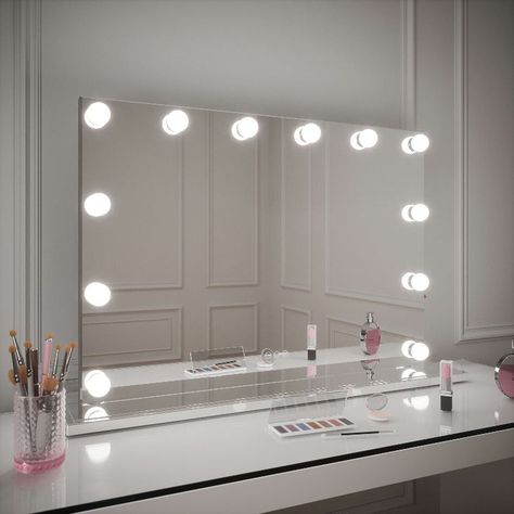 Full Description Why Our Hollywood Mirrors are the Best? Whether you’re a makeup artist, beauty guru, or just trying to capture the perfect ‘Instagram pic’ or Tiktok video, this mirror is definitely for you! The Scarlett Mirror is a glamorous addition to your dressing room or bedroom. This top-quality vanity mirror includes 13 x 3 Watt tri colour LED bulbs that will give you the perfect bright lighting to apply your makeup easier. This mirror has been designed with an edge-to-edge front to give Make Up Desk Mirror, Hollywood Mirror Dressing Table, Bedroom Decor Girly, Coastal Desk, Lights Around Mirror, Bedroom Vanities, Bedroom 2024, Hollywood Vanity Mirror, Vanity Mirror With Lights