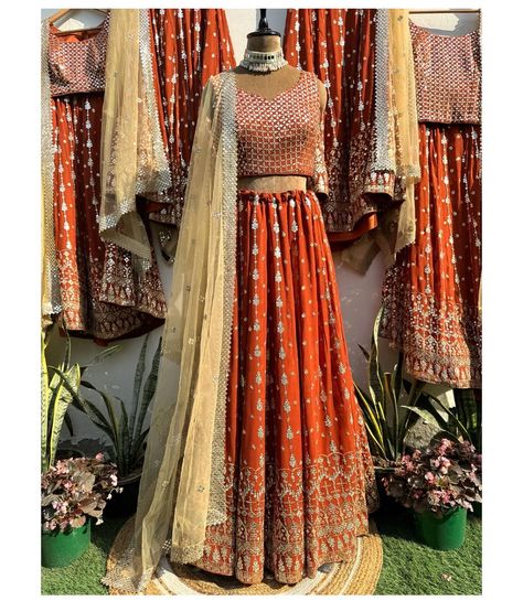 Bridesmaids outfits! Shiny sequins are embroidered in a linear pattern on this beautiful rust lehenga. Statement embroidered blouse is a sure head turner. It’s perfect glamorous outfit for the festive/wedding season. To place your order DM or WhatsApp us at 9971767771. It can be customised in any colour of your choice. [mirror embroidered lehenga, rust lehenga, bridesmaid outfit, Indian wedding dress, bride to be] #labelsnigdhakapoor #lehenga #indianwedding #rustlehengacholi #mirrorlengha... Rust Lengha, Festive Embroidered Lehenga, Luxury Unstitched Embroidered Lehenga, Diwali Multicolor Embroidered Lehenga With Mirror Work, Rust Colour Lehenga, Festive Wedding, Glamorous Outfits, Linear Pattern, Bridesmaid Outfit