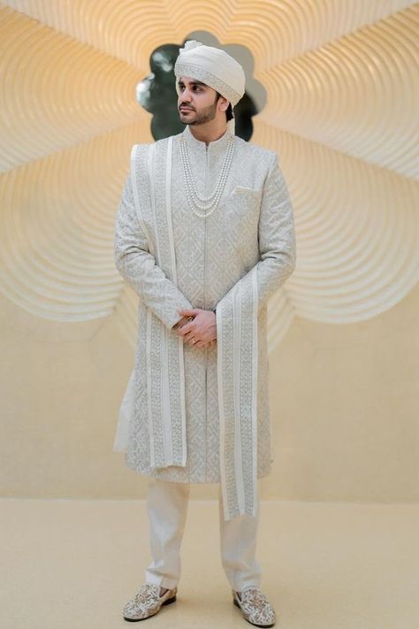 White has been ruling the charts not just for women but also for men. Here are some of the latest white sherwani designs for grooms to choose for their D-day! White Sherwani Indian Groom, Pakistani Sherwani Grooms, Groom Sherwani Indian Latest, Sherwani For Men Wedding Pakistani, Light Grey Suit Men, Chunni Designs, Groom Sherwani Indian, Groom Clothes, Lehenga Designs Latest