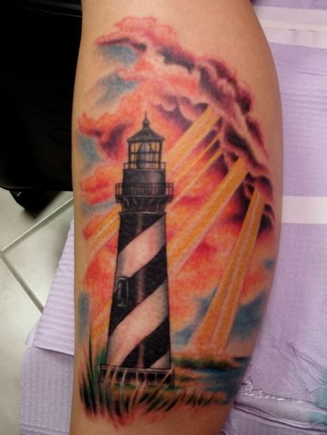 Love the rays of sun shining down on the lighthouse. Like God is watching over us. Light House Tattoo, Lighthouse Tattoo Meaning, Corey Miller, House Tattoo, Lighthouse Tattoo, Beach Tattoo, Memorial Tattoos, Home Tattoo, School Tattoo