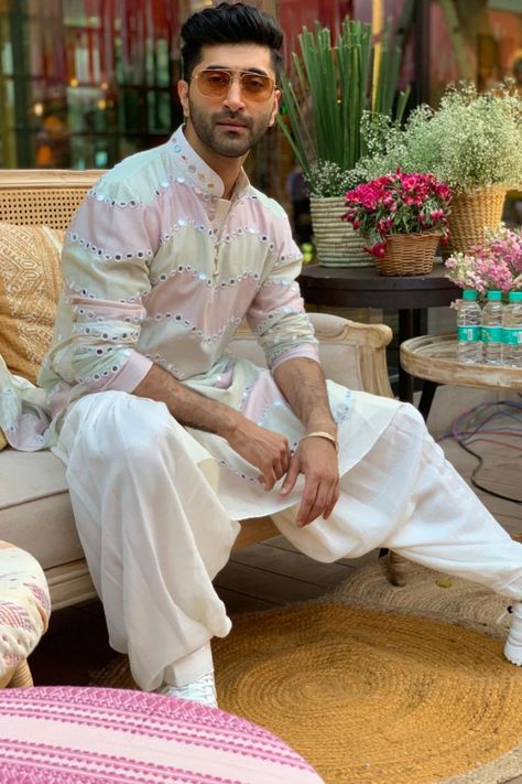 Multicolored kurta with dhoti pant and sequin stole Mirror Work Kurta For Men Wedding, Colorful Kurta For Men, Men Sangeet Outfits, Pastel Kurta Men, Mirror Kurta Men, Sequin Kurta Men, Mirror Work Kurta For Men, Haldi Ceremony Outfit For Men, Sangeet Outfit For Men