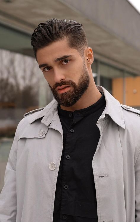 If you are a fan of the slicked-back style, then note that you can integrate it with the temple fade as the two seem to blend well together. This style features tapered temples. You can also further improve the look of this slick back temple fade hairstyle by creating a seamless transition between your beard and temple area. Temple Fade Haircut, Mens Slicked Back Hairstyles, Temple Fade, Tapered Beard, Slick Back Hairstyle, Slick Back Haircut, Mustache And Goatee, Mid Fade Haircut, Fade Haircuts For Men