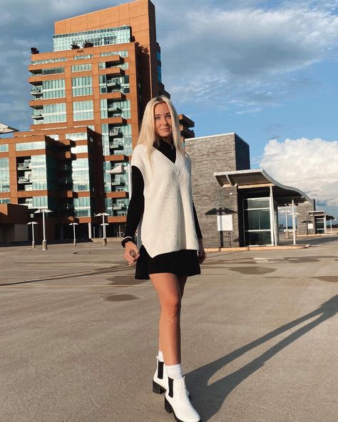 Black long sleeve dress with a white sweater vest oven top and some white booties with white high socks. White High Socks, White Sweater Vest, Oven Top, White Booties, Black Long Sleeve Dress, White Sweater, White Sweaters, High Socks, Sweater Vest