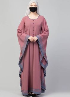 This gorgeous pink kaftan abaya from Musheco features elegant stripes along the borders for a stylish contrast. Made from soft kashibo fabric, it's perfect for casual wear. The stitched construction ensures good drape and flow. Complete your modest chic look with this abaya dress featuring a plain design and subtle stripes in a complementary color. #abaya #abayas #abayadress #abayadresses #abayaforwomen #abayasforwomen #abayafashion #abayaclothing #abayadesigns #designerabaya Pink Kaftan, Muslim Women Clothing, Kaftan Abaya, Kaftan Style, Islamic Dress, Elegant Attire, Muslim Fashion Dress, Muslim Outfits, Muslim Dress