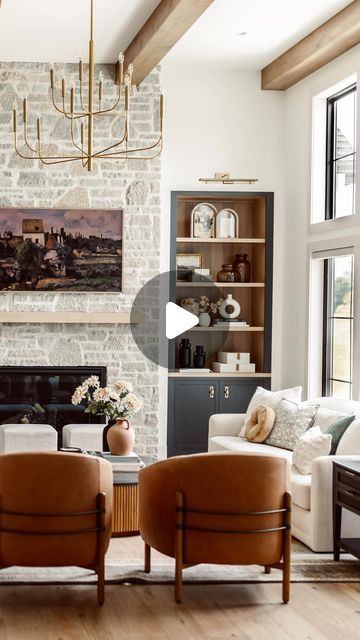 Ashley Haley on Instagram: "It’s officially Day 1 of @madisonpoh ✨Welcome to the great room. Here we have white oak engineered wood floors, gorgeous two-tone built-ins flanking the story-and-half tall stone fireplace, and we topped it all off with a brushed brass chandelier framed by wood beams.

Design by @oslodesignco 
Build by @ackerbuildersinc 
Materials by @coylecarpet1madison 
Lighting by @madisonlighting 
Furnishings from @arhaus & @fourhandsfurniture 
Photography by @ep.studio_ 

#interiordesign #newconstruction #wisconsininteriordesign #wisconsinnewconstruction #organicmodern #madisonpoh #design #greatroom #stonefireplace #builtins #decor" Builtins Decor, Tall Stone Fireplace, Engineered Wood Floors Oak, White Oak Floors, Engineered Wood Floors, Wood Beams, Brass Chandelier, Wallpaper Decor, Trendy Home