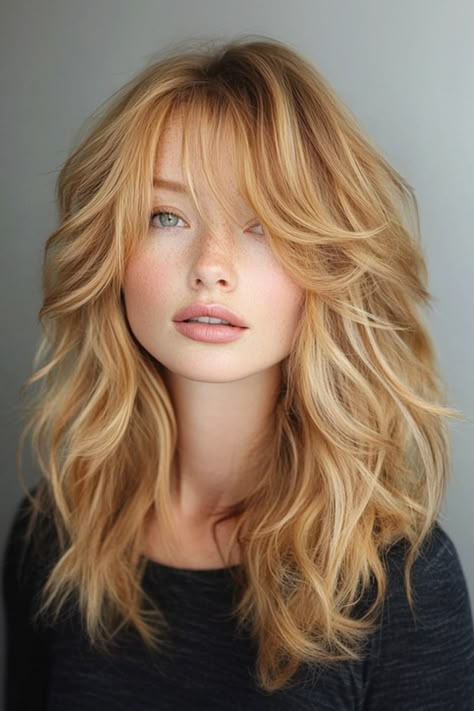 A feather haircut with bangs in strawberry blonde is effortlessly stylish! The soft, feathered layers add movement and volume, while the bangs frame your face beautifully. Hairstyle For Oval Face, Front Bangs Hairstyles, Light Honey Blonde, Feathered Layered Hairstyles, Strawberry Blonde Hair Ideas, Butter Blonde Hair, Butter Blonde, Blond Hair Blue Eyes, Blonde Hair Goals