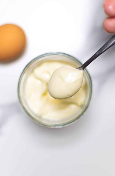 spoon full of homemade mayonnaise with an egg in the background Blender Mayonnaise Recipe, Prepared Eggs, Mustard Recipe, Garlic Mayo, Homemade Mayo, Mayonnaise Recipe, Homemade Mayonnaise, Small Food Processor, Recipe From Scratch