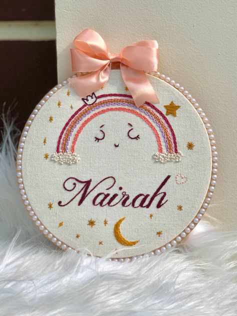 Customized name embroidery hoop in rainbow theme 🤍 Lovely theme done for cute little girl “NAIRAH” Hoop size :8 inch Name Hoop Embroidery, Name Embroidery Hoop, Hand Embroidered Name, Name Embroidery, Hoop Embroidery, Embroidered Name, Baby Embroidery, Rainbow Theme, Hand Embroidery Designs