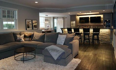 Living room with home wet bar with wood backsplash under counter lights and bar stools Basement Rooms, Basement Designs, Basement Layout, Modern Basement, Basement Bar Designs, Basement Reno, Basement Living Rooms, Cozy Basement, Loft Ideas