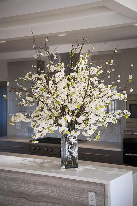 This rustic arrangement of lifelike white Cherry Blossoms is a spectacular display for any season. The dark, natural-looking branches are filled with dozens of realistic flowers with small green leaves. Each stem is permanently set in a glass column vase in clear acrylic solution that looks just like water. The 4.5-foo Tall Flower Arrangements For Home Living Rooms Coffee Tables, Large Wide Mouth Vase Arrangements, Medium Flower Arrangements Glass Vase, Tall White Vase With Branches, White Floral Bouquey For Eigfel Tower Vase, Fake Flower Arrangements In Tall Vase, Clear Vase Winter, Flower Arrangements For Table Tall Vases Willow Branches, Winter Floral Arrangements Centerpieces For White Vase