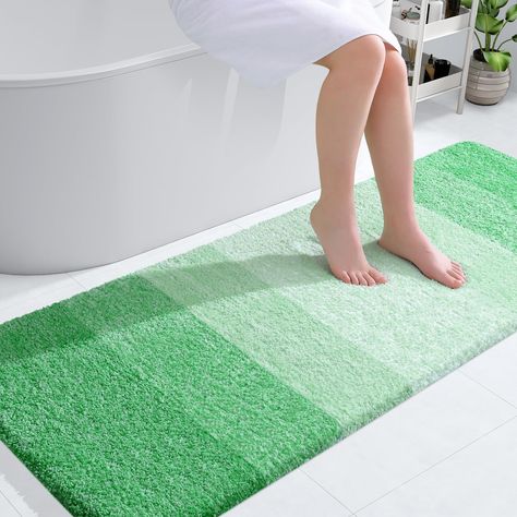 Mint green tile bathroom