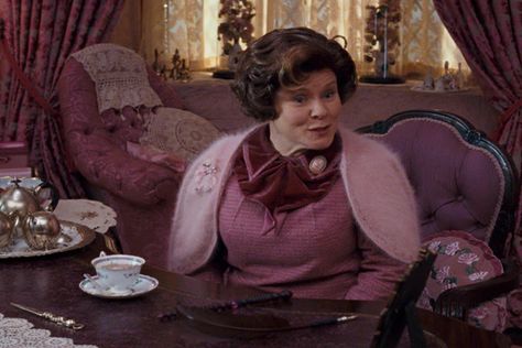 All Things Knitted in Harry Potter and The Order of the Phoenix Umbridge Aesthetic, Pink Fuzzy Jacket, Harry Potter Scrapbook, The Others Movie, Dolores Umbridge, Cable Knit Vest, Purple Jacket, Colorful Scarf, The Order