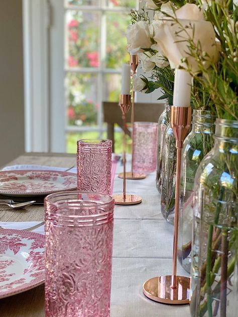 I love setting tables for spring! It's fun and I especially love how much using colored glasses on your table can create so much excitement in a table setting. Pink Dining Table, Spring Place Settings, Easter Basket Centerpiece, Spring Reset, Tablescapes Spring, Dreamy Interiors, Color Glasses, Cottage Table, Spring Table Settings