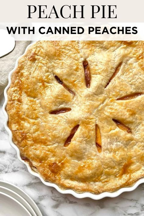 This fresh peach pie recipe is made with a homemade flaky pie crust that's baked to perfection with a sweet peach pie filling made from canned peaches, sugar, cinnamon, nutmeg, vanilla extract, and lemon juice. Save for later! Southern Peach Pie Recipes, Home Made Peach Pie, Canned Peach Pie Recipes Easy, Peach Pie With Jarred Peaches, Easy Peach Pie Filling Canned, Sour Cream Peach Pie, Peach Apple Pie, Peach Pies Recipes, Pies That Don't Need Refrigeration