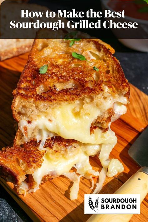 Two slices of sourdough grilled cheese with gooey cheese on a cutting board. Sourdough Grilled Cheese, Grilled Cheese Recipes Gourmet, Homemade Grilled Cheese, Perfect Grilled Cheese, Making Grilled Cheese, Sourdough Bread Sandwiches, Gourmet Grilled Cheese, Sourdough Sandwich, Cheese Sandwich Recipes