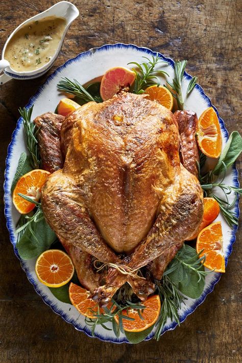 This roasted turkey is simple and no-fuss, but still packed with seasonal flavor. Garnished with clementines, it also makes for an excellent edible centerpiece. Easy Turkey Recipes, Thanksgiving Potluck, Roast Turkey Recipes, Potluck Ideas, Easy Thanksgiving Recipes, Best Thanksgiving Recipes, Herb Stuffing, Best Turkey, Turkey Recipes Thanksgiving