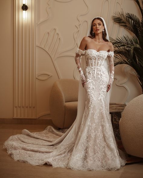 Luxury wedding dress «Flower» from the 2025 collection. Astonishing off-shoulder mermaid gown fully covered in platinum glitter and French Chantilly featuring a lace-up back, and a long, wide train. The bodice and top of the skirt are decorated with soft 3D floral appliques. The gown can be complemented with bicep-length Chantilly sleeves and detachable off-shoulder straps. #weddingbudapest #eskuvoiruha #esküvő #bride2024 #weddingdressinspiration Lace Sleeve Wedding Dress, French Lace Wedding Dress, Fantasy Nature, Wedding Dresses With Flowers, Wedding Plan, Sophisticated Wedding, Dream Wedding Ideas Dresses, Muslim Fashion Dress, Luxury Wedding Dress