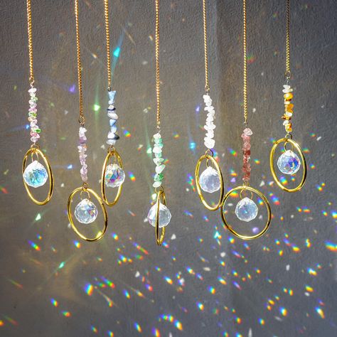 PRICES MAY VARY. Healing Crystals Suncatcher - Bring some rainbows into your space with this sun catcher featuring one bar of natural birthstone crystals and one 20mm crystal glass prism.Packed with 7pcs, each length is about 12.2inch,weight is 185g/set Rainbow Maker - When you hang your sun catcher near a sunny window, it will fill the room with beautiful flecks of colorful light. It's a perfect year-round addition to any space, but also provides a wonderful little pick me up for the winter blu