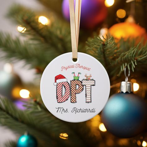 Hey, are you in search of a unique Christmas ornament that also doubles as a thoughtful gift for a clinical fellow or a physical therapist who has recently graduated? Well, look no further because our DPT Christmas ornament is just what you need! This meticulously crafted ornament is the ideal way to show appreciation to a PT teacher, occupational therapist, physical assistant, or physiotherapist. Whether you're celebrating the achievements of a doctor of physical therapy, a pediatric PT, or anyone in the field, this ornament is the perfect sentimental touch. Let this ornament symbolize the hard work and dedication put into the world of physical therapy. It's more than just a decoration; it's a heartfelt gesture filled with meaning. Make this Christmas special with our DPT Christmas orname Physical Therapy Graduation, Pediatric Pt, Doctor Of Physical Therapy, Therapy Gift, Unique Christmas Ornaments, Show Appreciation, Occupational Therapist, Physical Therapist, Hard Work And Dedication