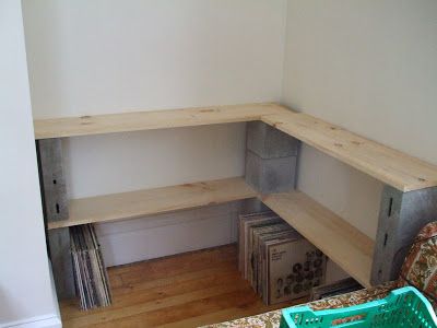 DIY custom record shelves: Never underestimate the efficacy of good ol' cinder blocks and pine boards - especially if you've got a small odd-shaped area to work with. This unused corner area was converted to a record station for a mere $30. Cinder Block Shelf, Record Station, Block Shelves, Cinder Block Shelves, Record Shelves, Wood Bench Design, Custom Record, Custom Shelf, Cinder Block Furniture