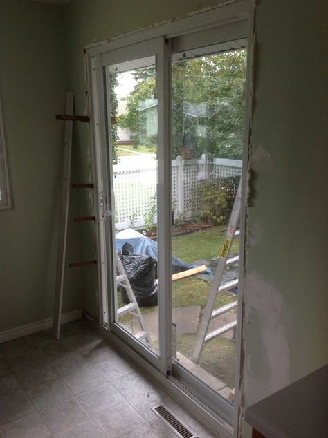 The patio door after it has been installed. Window To Patio Door Conversion, Window To Sliding Door Conversion, Window To Door Conversion, Patio Door Installation, Patio Installation, Sliding Glass Doors Patio, Glass Doors Patio, Sliding Patio Doors, Patio Door