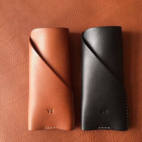 "A stylish glasses/sunglasses case. Has a front slot, able to hold clean cloth, pen or card. (Please chose thread colour) - 100% Vegetable tanned leather - Hand stitched with waxed thread - Edges are burnished to smooth sheen - Comes with 100% cotton bag Approximate Dimensions: W 3.25\" x H 6.75\" x D 0.5\" W 8cm x H 17cm x D 1cm Personalisation (optional) - Complimentary personalisation is available. - You can chose up to 6 letters (capital alphabet only (6mm height). include 'space' and 'dots' Leather Sunglasses Case, Capital Alphabet, Leather Working Patterns, Leather Glasses Case, Glasses Cases, Leather Key Holder, Leather Key Case, Leather Key Fobs, Stylish Glasses