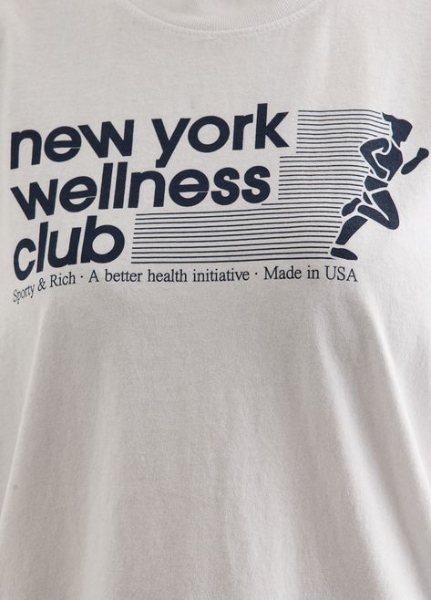 All about health and wellness, Sporty & Rich is the Los Angeles-based label that prides itself on sustainability, quality and a distinct '90s-inspired sports aesthetic. Crafted from cotton, the USA Wellness Club T-Shirt is adorned with a printed 'New York Wellness Club' slogan across the chest. - Garment-dyed cotton - Crew-neckline- Printed 'New York Wellness Club' slogan on front - Short sleeves - Relaxed fit Materials:100% Cotton. Care:Cold machine wash. Sizing: Item fits true to size. Model w Sports Clothes Aesthetic, Sporty And Rich Shirt, Marathon T-shirt, Sporty And Rich Tshirt, Sporty And Rich Wellness Club, Run Club Shirt, Sporty & Rich, Sports Club Design, Wellness Merch