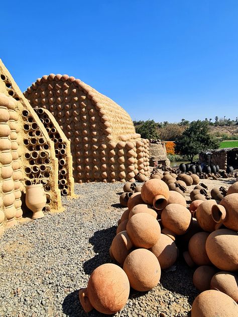 This intervention of reviving the Al-Nazlah area in Fayoum aims to create a pilot project in contexts of specificity. The valuable district incubates pottery workshops which have been producing special pots used for construction since Ancient Egyptian Civilization. Thus, the upgraded construction technique which enhanced the bonding material by gluing the pots together with the help of lab experiments maintained the traditional technique. Also, new forms have been introduced for roofing construc Pottery Architecture, Ancient Egyptian Civilization, Sculpture Architecture, Egyptian Civilization, Elegant Fashion Outfits, Mud House, Pottery Workshop, Facade Design, Traditional Techniques