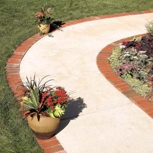 Make an attractive border for a concrete walkway or patio using brick pavers set on a bed of gravel and sand. With a solid gravel base, a brick border will last for the life of your house. Brick Border, Path Edging, Concrete Path, Brick Edging, Concrete Patios, Brick Walkway, Concrete Walkway, Garden Walkway, Landscape Edging