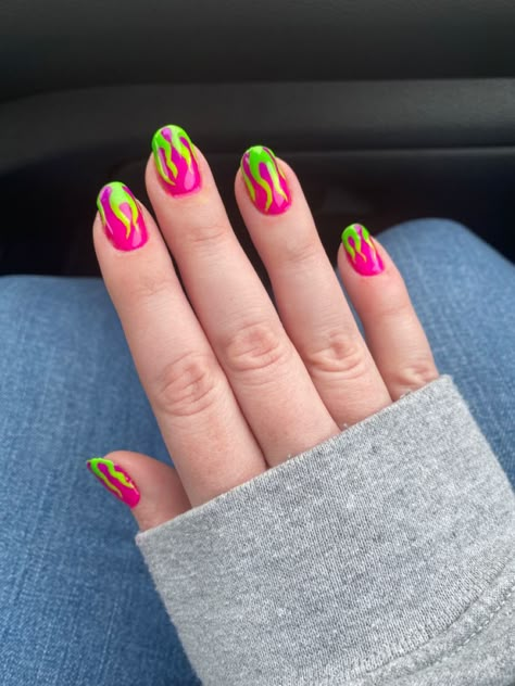 At home gel nails with neon flame art Short Lava Lamp Nails, Short Nail Neon Designs, Rave Manicure, Neon Funky Nails, Short Nail Designs Neon, Neon Party Nails, Nail Fire Art, Short Trippy Nails, Rave Nails Short