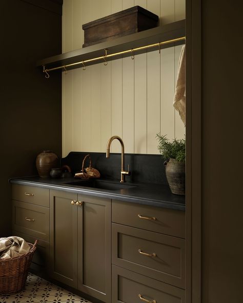 Easy living with a timeless laundry room design. The patterned floor tiles evoke the charm of a classic cottage, seamlessly blending with the modern construction. Earthy soapstone countertops and rich brown cabinetry add a warm, moody touch, creating a space that’s both functional and inviting. Photographed by @patrickbiller Built by @muellercustombuild Timeless Laundry Room, Wood Worktop Kitchen, Tiffany Leigh Design, Wood Worktop, Soapstone Countertops, Classic Cottage, Brown Marble, Patterned Floor Tiles, Easy Living