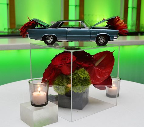 Flower & Car Centerpiece courtesy of Black Dahlia Designs Vintage Car Centerpiece Ideas, Car Themed Table Decorations, Classic Car Centerpieces, Vintage Car Centerpieces, Lowrider Centerpieces, Classic Car Centerpieces Ideas, Car Themed Wedding Ideas, Mechanics Birthday Party, Car Themed Wedding