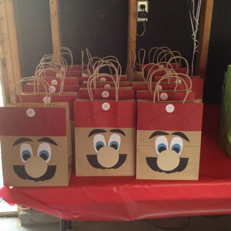 Mario birthday party gift bags. Favor ideas to remember: Red and green suckers w mustache, gold coin chocolates, mario fruit snacks Treat Bag Ideas, Birthday Party Gift Bags, Mario Brothers Birthday Party, Spongebob Birthday Party, Mario Bros Party, Spongebob Birthday, Mario Birthday Party, Super Mario Birthday, Super Mario Party