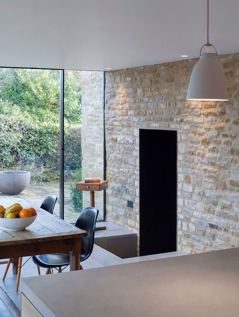 Original stone walls act as the backdrop for the new dining space and kitchen British Cottage, Yew Tree, Limestone Wall, Glass Extension, Cottage Renovation, Modern Extension, Kitchen And Dining Room, Stone Walls, Kitchen Extension