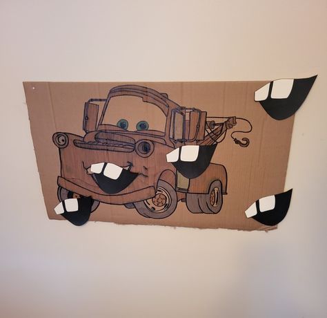 I printed an image on Mater on multiple pages to achieve my desired size;  traced it on to a piece of cardboard and colored it in. Using my orignal print, I traced his mouth onto card stock paper and simply used a black sharpie to color in the darkness of his mouth. Cars Birthday Party Games Activities, Pixar Cars Birthday Party Activities, Cars Birthday Games, Cars Birthday Activities, Mater Themed Birthday, Pixar Cars Birthday Party Decorations, Cars Pixar Birthday Party Ideas, Tow Mater Birthday Party, Cars Decorations Party