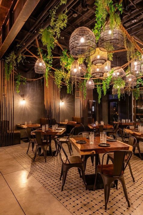 Industrial Boho Restaurant, Filipino Style Restaurant Interior, Hospitality Design Restaurant, Restaurant Themes Interior, Lighting Restaurant Design, Forest Themed Restaurant, Bar Designs For Restaurants, Wooden Restaurant Tables, Mid Century Modern Restaurant Design