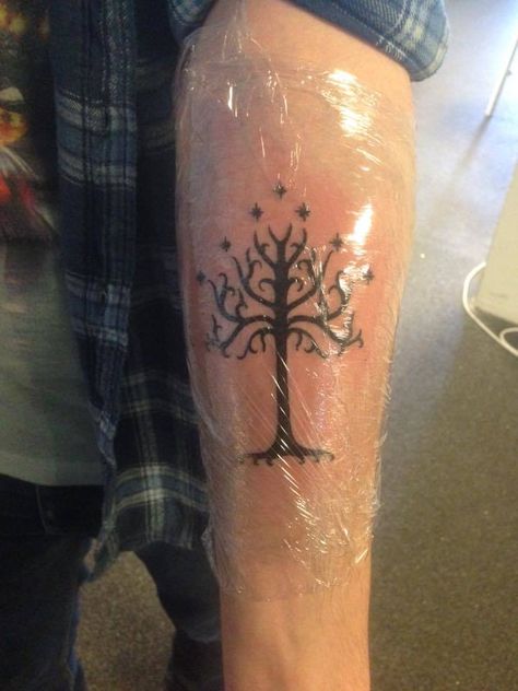 Got the White Tree of Gondor for my first tattoo (Done by Jayvee The Rising Bastards Nijmegen) #Tattoos https://t.co/tDNJ98dl9I Please Re-Pin It! Fangirl Tattoos, Gondor Tattoo, Tree Of Gondor Tattoo, Tolkien Tattoo, White Tree Of Gondor, Ring Tattoo Designs, Tree Of Gondor, Lotr Tattoo, Lord Of The Rings Tattoo