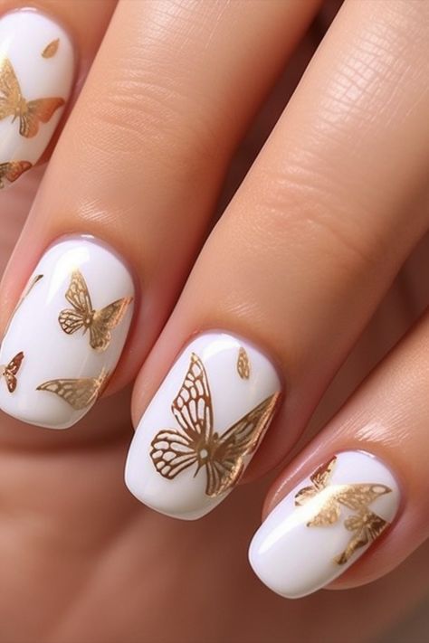 Whimsical Wonder: Stunning White Nails with Playful Butterflies Gold Butterfly Nail Designs, Wedding Nails Butterfly, White And Gold Butterfly Nails, White Nails With Butterflies, Bridal Party Nails, Nail Art White Nails, White Butterfly Nails, Nails With Butterflies, Nail Art White