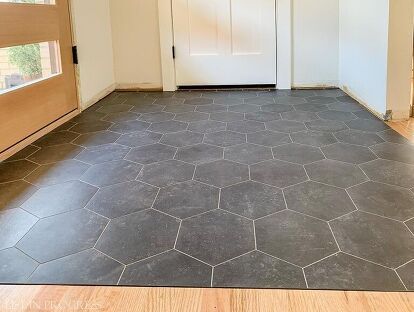 If you want the look of ceramic or porcelain tile but not the price tag or hassle, try groutable vinyl tile instead. It's affordable, easy to install, durable, water-resistant, and looks great! We just installed groutable vinyl tile in our entry; here's our DIY-friendly project tutorial. Get all the sources and more details in my original blog post. What is Groutable Vinyl Floor Tile? Vinyl flooring ranges from planks to sheet products, and today we’re talking about peel-and-stick ti… Peel And Stick Groutable Vinyl Tile, Quadrostyle Vinyl Tiles, Groutable Luxury Vinyl Tile Flooring, Tile Looking Vinyl Flooring, Vinyl Floor Tiles Bathroom, Best Peel And Stick Floor Tile Bathroom, Peel And Stick Slate Floor Tile, Diy Kitchen Tile Floor, Vinyl Flooring Tile Look