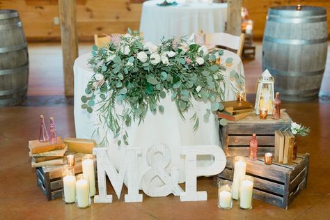 Rustic sweetheart table with crate stacks, pillar candles, blush pink vases, lanterns Sweetheart Table With Crates, Hennessy Wedding, Rustic Sweetheart Table, Pink Vases, Sweetheart Table Decor, Casual Beach Wedding, Dream Wedding Reception, Sweetheart Table Wedding, Diana Wedding