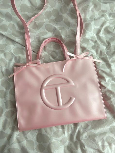 Ballerina pink telfar with bows tied to the handle of the telfar bag. This is Telfars latest pink bag release Ballerina Pink Telfar, Ballerina Telfar Bag, Tel Far Bag, Pink Dior Bag, Telfar Medium Bag, Pink Telfar, Telfar Bag, Uni Bag, Luxe Handbags