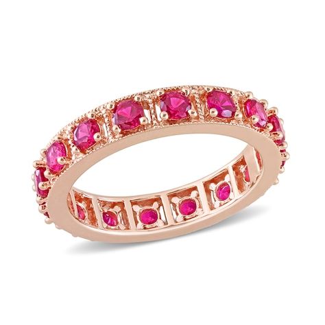 Display your everlasting love with this vibrant and vintage-inspired red lab-created ruby eternity band. Fashioned in sterling silver with rose rhodium plate This choice glistens with an endless row of bright red lab-created rubies. Intricate milgrain-lined square-shaped frames add heirloom detail to the style. Ruby is the traditional birthstone for July and epitomizes integrity, confidence and strength. Ruby Eternity Ring, Ruby Eternity Band, Silver Cleaning, Women Jewellery, Jewellery Rings, Peoples Jewellers, Eternity Band Ring, Ruby Rose, Womens Wedding Bands