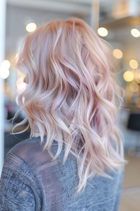 Woman with wavy pastel pink hair in a modern salon setting. Pastel Pink And Blonde Hair, Pastel Rainbow Hair Color, Purple Pastel Hair, Fun Hair Colors, Vivid Hair Color Ideas, Rainbow Hair Color Ideas, Pale Foundation, Pastel Purple Hair, Pastel Rainbow Hair