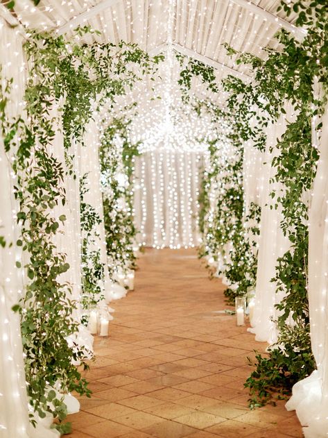 Using twinkle lights can enhance your wedding venue and wedding decor. Click to see 19 ideas of how to use twinkle lights throughout your wedding to upscale your wedding decor. #Wedding #Ideas #Details #TwinkleLights #Ceremony #ChristmasLights #SmallLights #WeddingVenue #WeddingDecor | Martha Stewart Weddings -  Dazzling Ways to Use Twinkle Lights Throughout Your Wedding Timber Arbour, Kiara Wedding, Walkway Decor, Natural Wedding Decor, Winter Wedding Table, Wedding Entrance Decor, Rustic Wedding Decorations, Wedding Entrance, Martha Stewart Weddings