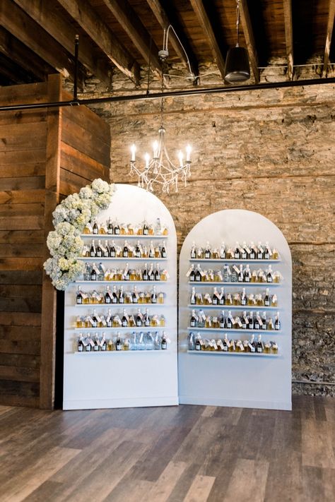 Champagne wall for wedding with beer and champagne bottles Champagne Wall Ideas Diy, Wedding Champagne Wall Seating Chart, Champagne Bottle Seating Chart, Tequila Wall Wedding, Neutral Event Decor, How To Build A Champagne Wall, Champagne Seating Chart, Champagne Wall Seating Chart, Champagne Wall Diy