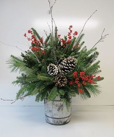 small barrel arrangement with evergreens, pinecones and berries Christmas Arrangements Diy, Christmas Greenery Arrangements, Christmas Floral Arrangements Diy, Christmas Centerpieces Cheap, Xmas Centerpieces, Holiday Floral Arrangements, Winter Arrangements, Christmas Centers, Christmas Vases