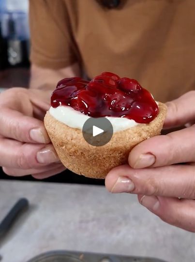 5.5K views · 53 reactions | Mini Sugar Cookie Cheesecakes 😍 | Mini Sugar Cookie Cheesecakes 😍 | By Brain Food | One is one of my favorites. I love using Pillsbury store-bought dough. In this case, we're using some sugar cookie dough and a muffin tray and then, I just added a ramekin in the center of each one and that's in order to keep the divot because what we're going to do after these are baked is turn them into cheesecake. That's right. So, these go in the oven. We bake them according to the package and then, we get on the cheesecake mixture. In a stand mixer, or you can use a hand mixer in a whisk all good I got some cream cheese some sweet and condensed milk that gets whisked up just until it's combined and we're going to add some more sweetened condensed milk and keep whisking thi Mini Sugar Cookie Cheesecake Cups, Sweet And Condensed Milk, Pillsbury Sugar Cookie Dough, Cheesecake Mixture, Sugar Cookie Cheesecake, Sugar Cookie Dough Recipe, Pillsbury Cookies, Pillsbury Sugar Cookies, Sugar Cookie Crust