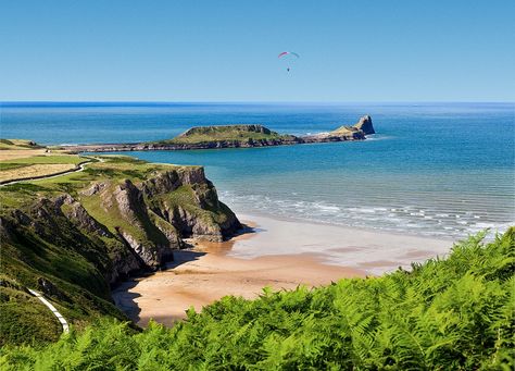 A BEACH in the UK has been described as a “fairytale” with almost three quarters of Brits convinced it is abroad. The cost of going abroad on holiday is rising, but fortunately there are some amazing spots for Brits to visit, without even leaving the country. One of those is Rhossili Bay Beach in the […] Rhossili Bay, Swansea Bay, Leaving The Country, Gower Peninsula, Going Abroad, Uk Beaches, Visit Wales, Coastal Artwork, Picture Library