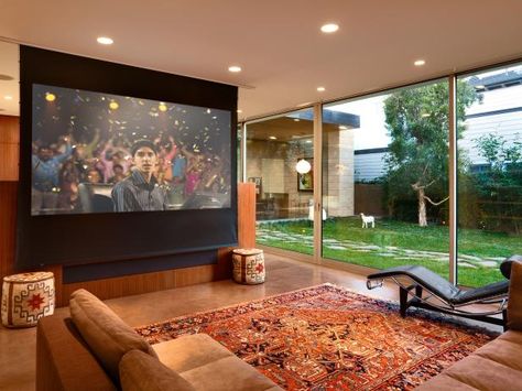 DIY Network shows you how to mount a large projector screen onto a wall or ceiling. Projector Screen Living Room, Large Projector Screen, Projector Screen Diy, Media Room Seating, Basement Home Theater, Home Theater Furniture, Media Room Design, Basement Living Rooms, Best Home Theater